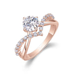 Tori Round Moissanite Twist Engagement Ring in 18K rose gold plating